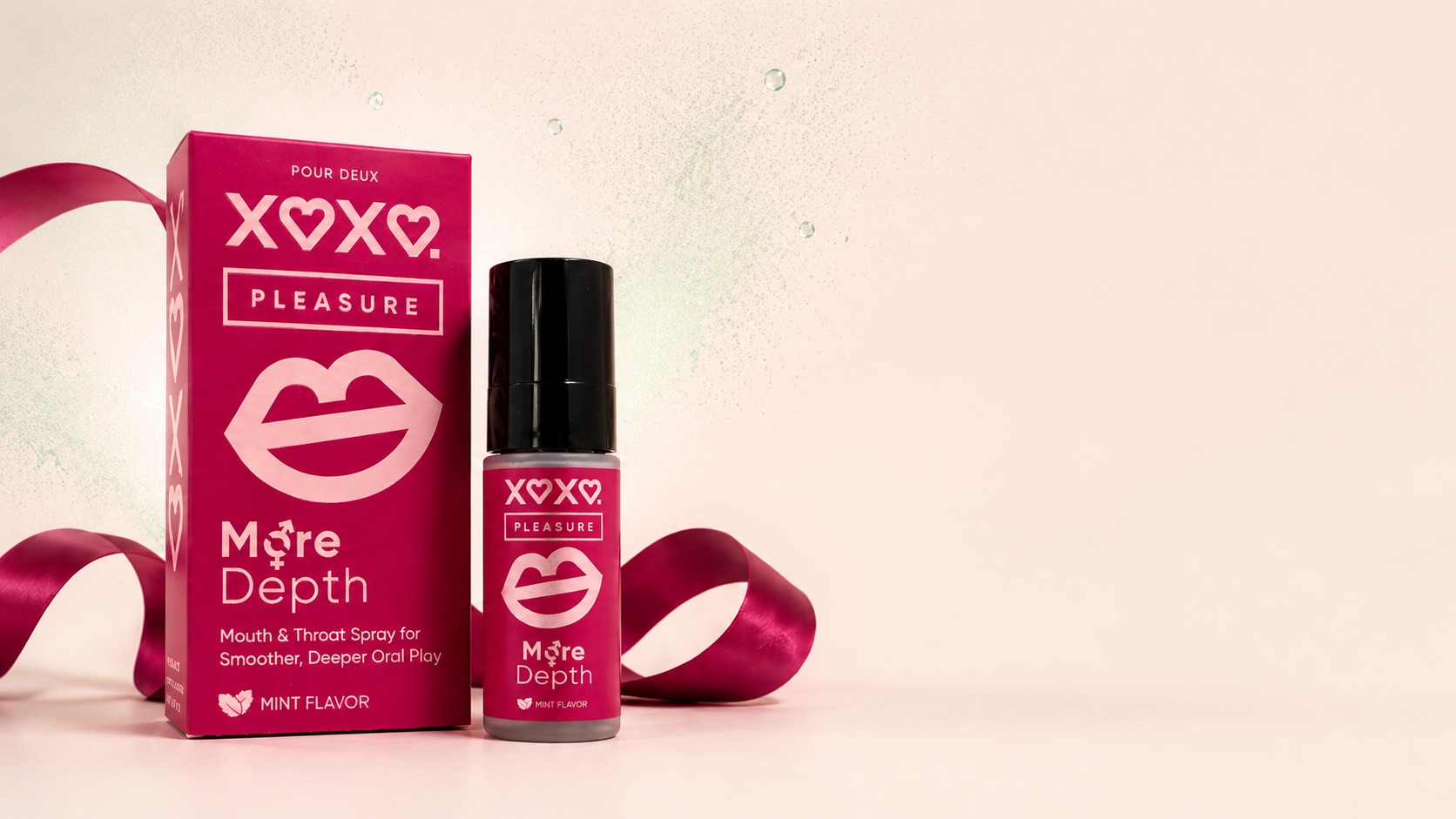 XOXO Pleasure raspberry box and spray bottle with a satin ribbon