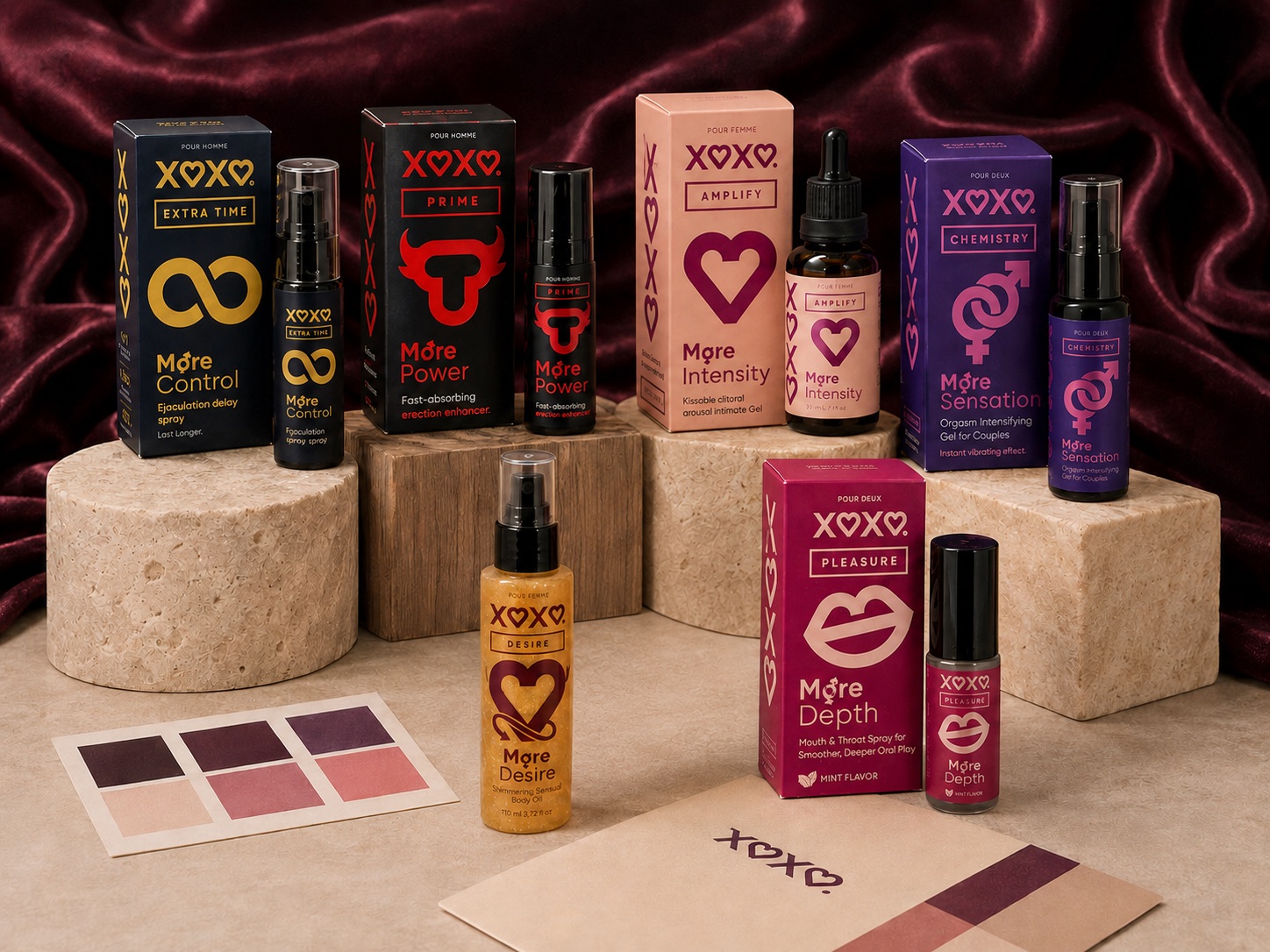 All six XOXO products arranged on stone pedestals with color swatches
